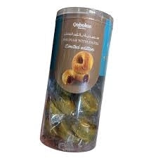 Qabalan Smediah with dates cylinder packaging showing golden foil wrapped baklava layers and beige label with teal stripe