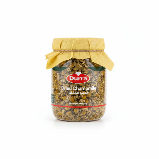 Durra Dried Chamomile 75g glass jar with mustard-yellow fabric lid and natural twine, showing pale yellow Egyptian chamomile flowers