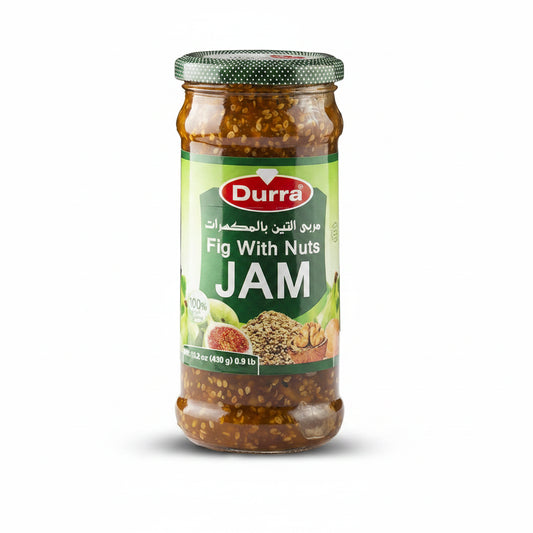 Durra Fig With Nuts Jam in clear glass jar with green polka dot lid showing chunky brownish-amber spread with walnuts and sesame seeds