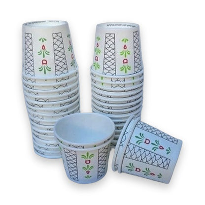 Al Samman Future 2oz white paper cups with black geometric lattice, green leaf motifs, and red squares for Arabic coffee