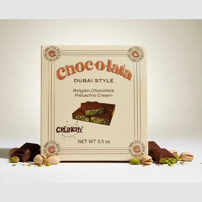 choc.o.lata Dubai Style Belgian Chocolate Pistachio Cream bar in cream box with copper script and crunchy pistachio filling