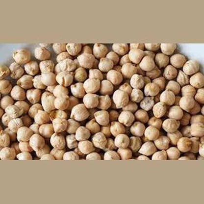 Dried raw beige chickpeas close-up showing natural matte texture and organic shape for meal prep