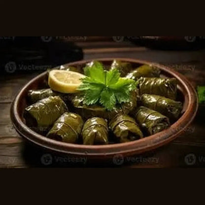 Hana stuffed grape leaves in terracotta bowl with lemon and parsley
