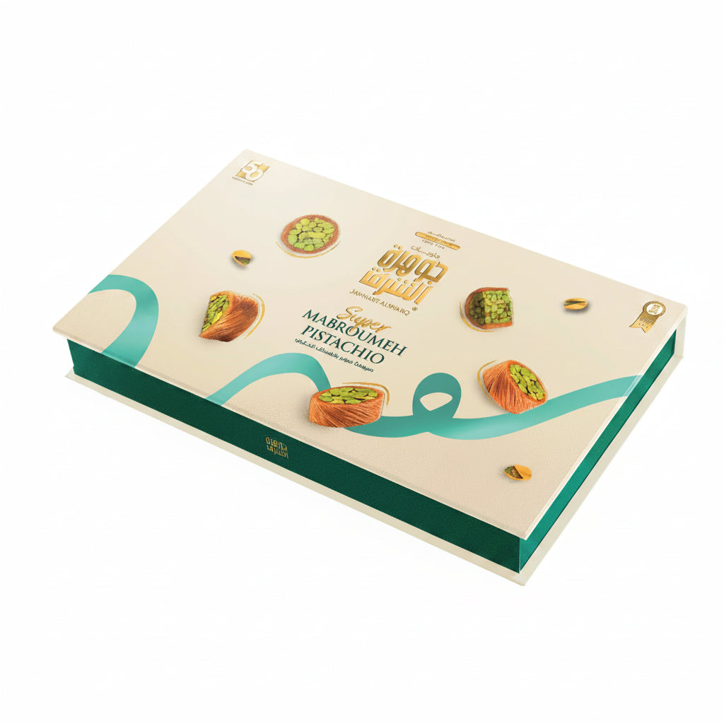 Jawhart Alsharq Super Mabroumeh Pistachio 750g closed gift box with teal base and cream lid featuring gold seal