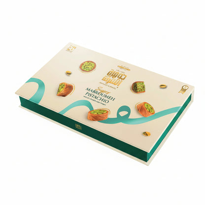 Jawhart Alsharq Super Mabroumeh Pistachio 750g closed gift box with teal base and cream lid featuring gold seal