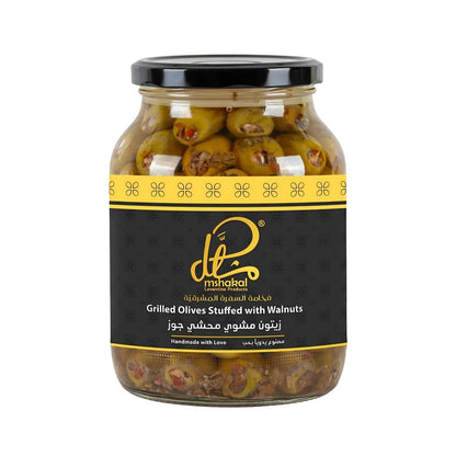 Mshakal Grilled Olives Stuffed with Walnut in clear glass jar with black and gold label