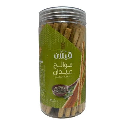 Side view of Qabalan Salt Sticks Thyme 250g highlighting granular texture and mint leaf illustration