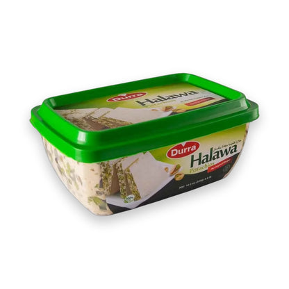 Durra Halawa Pistachios 700g in clear plastic tub with green lid showing creamy tahini base and chopped pistachios