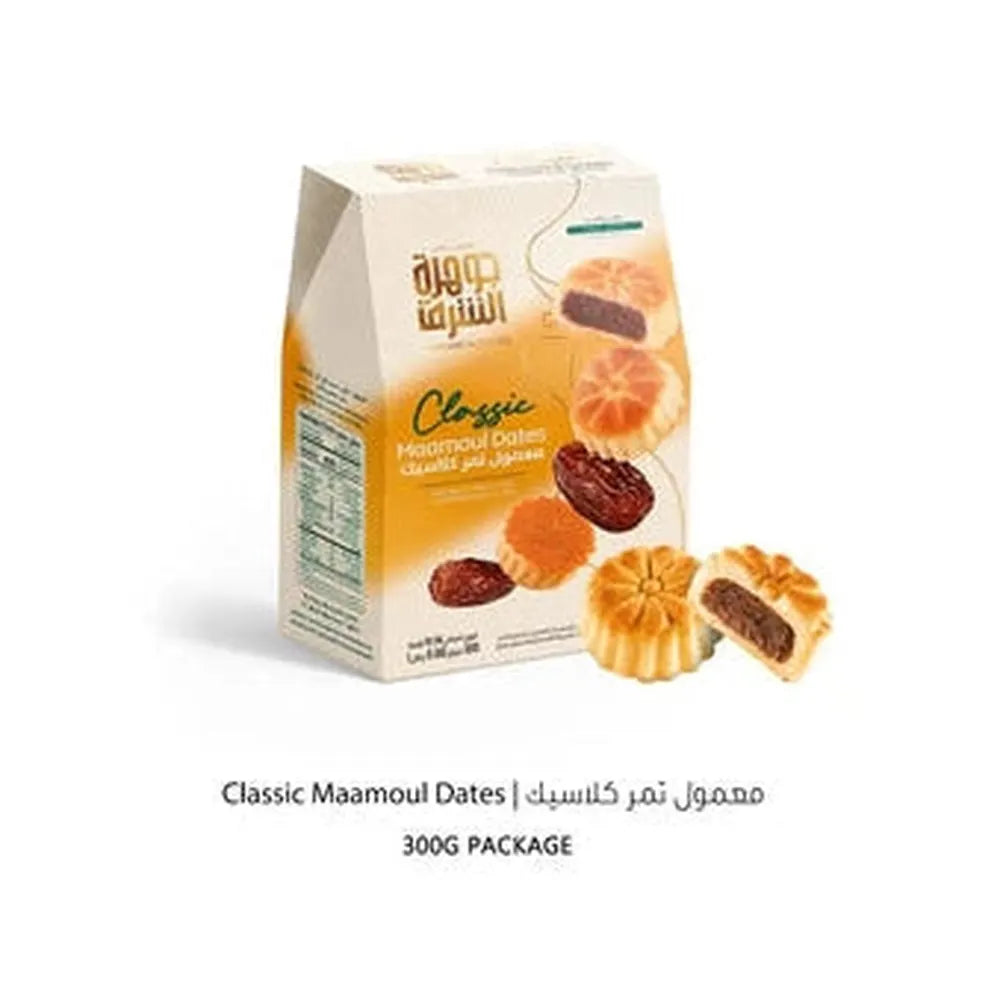 Jawhart Alsharq Classic Maamoul Dates 300g box with cream orange design showing whole and halved golden-brown cookies revealing dark date filling