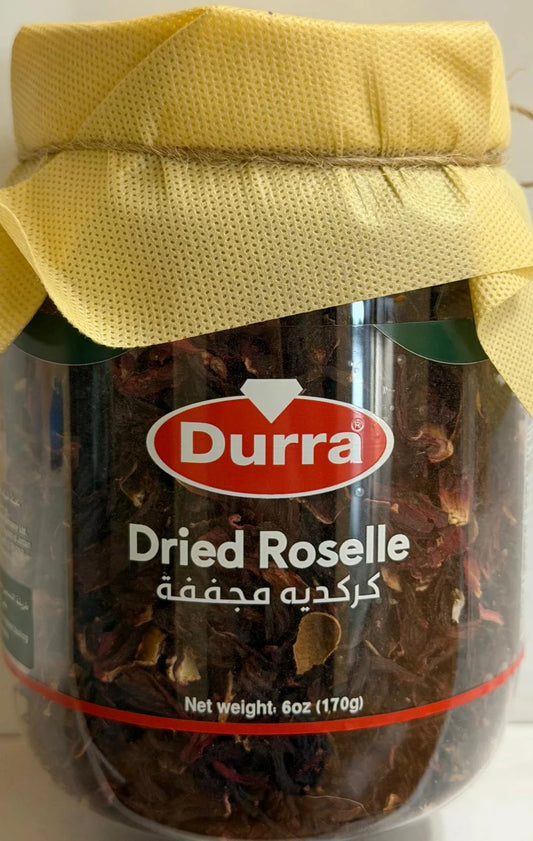 Durra Dried Roselle jar with deep burgundy hibiscus flowers, red label, and rustic twine lid